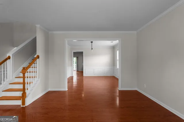 a view of an entryway with wooden floor