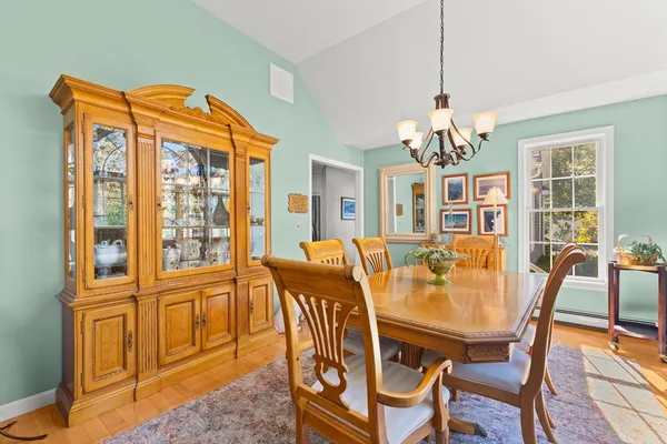 a dining room with furniture a livingroom and chandelier