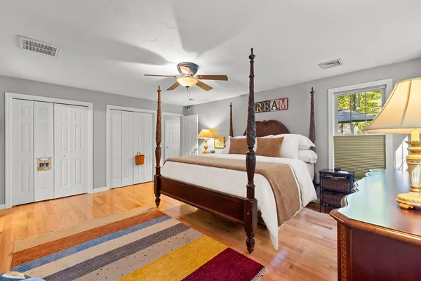 a bedroom with bed and window