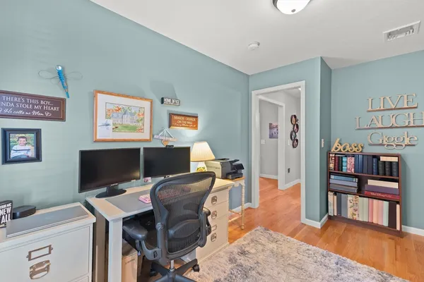 a workspace with furniture and bookshelf