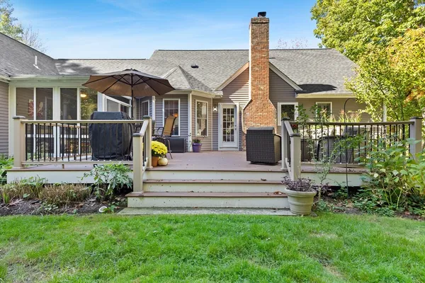 a view of a house with a garden and pathway