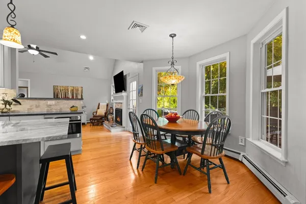 a view of a dining room with furniture window and wooden floor