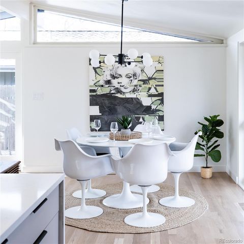 a dining room with furniture and chandelier