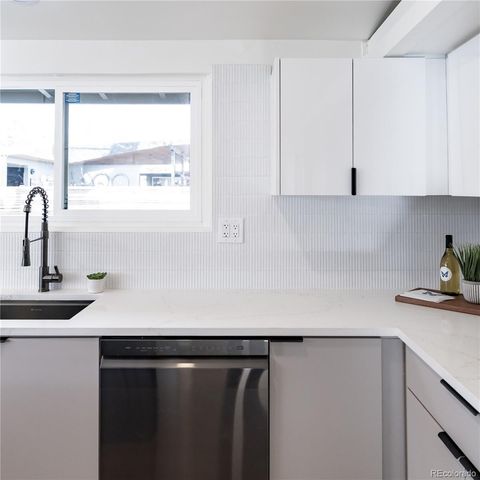 a kitchen with a sink and a window