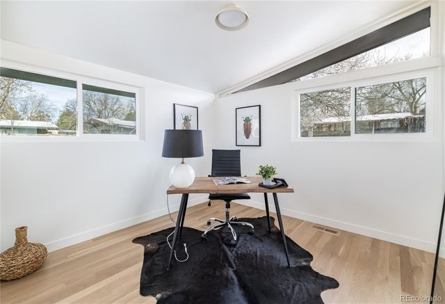 a workspace with furniture and a window