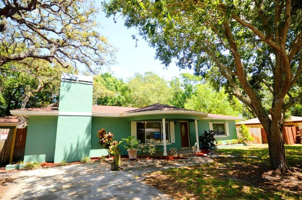 5203 Lazy Lane St. Petersburg, FL 33708 - Photo 1 of 1 Front yard and House Entrance.