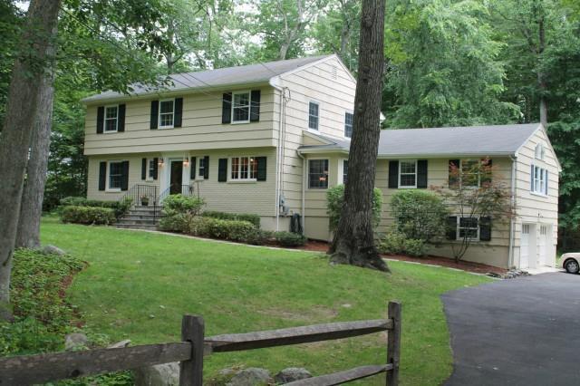 105 Country Club Road Stamford, CT 06903 - Photo 1 of 1 a front view of a house with a yard