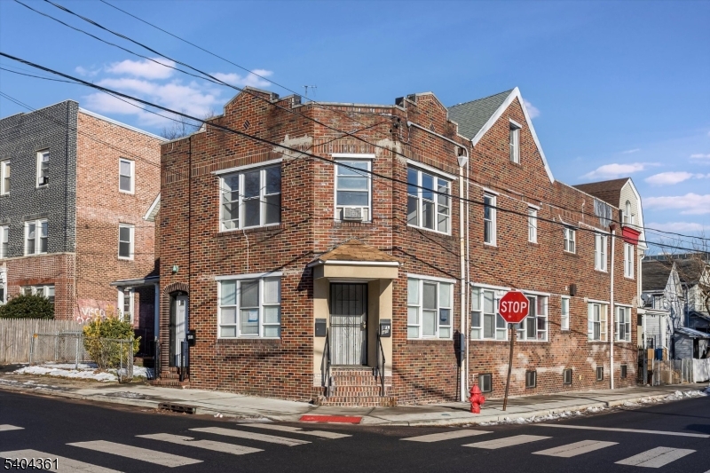 29 William Street Orange, NJ 07050 - Photo 2 of 10 a front view of a building and a street