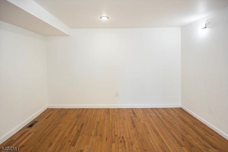 29 William Street Orange, NJ 07050 - Photo 8 of 10 a view of room with wooden floor