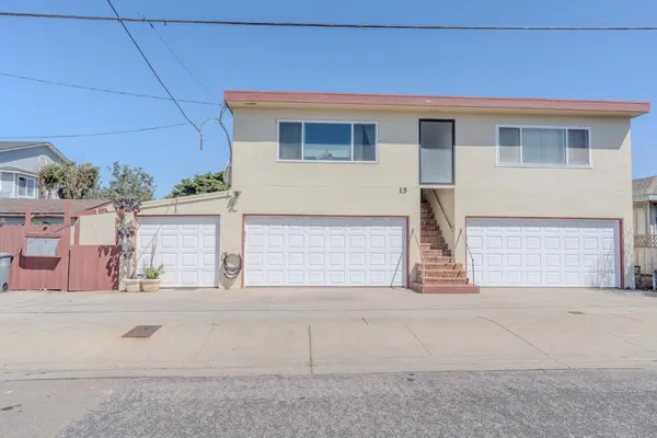 a front view of a house with a garage