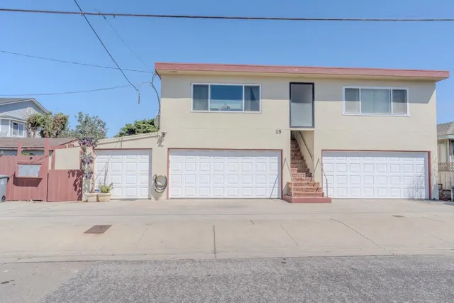 a front view of a house with a garage