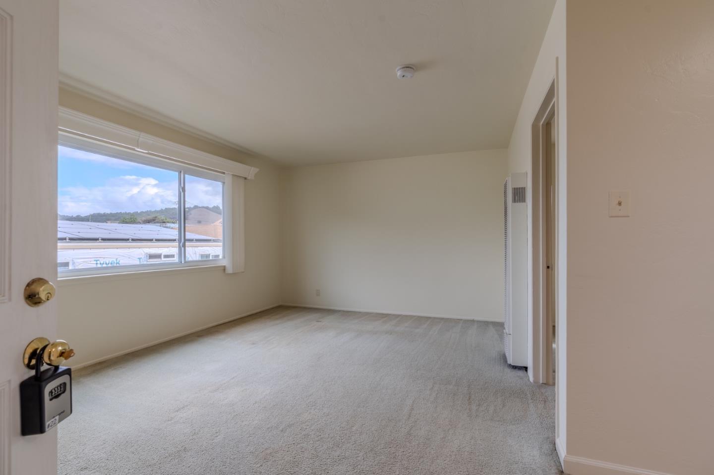 15 Santa Maria Avenue, Unit 3 Pacifica, CA 94044 - Photo 3 of 10 a view of an empty room with a window