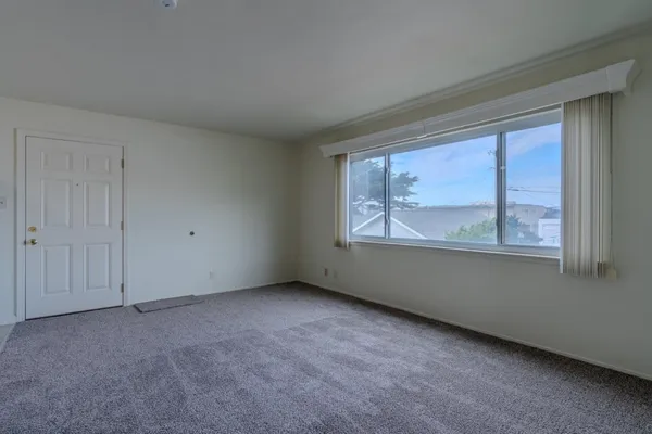 a view of an empty room with a window
