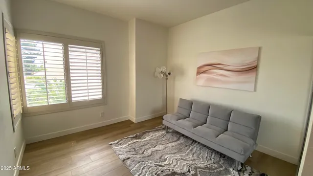 a living room with furniture and a rug