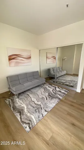 a view of a room with wooden floor