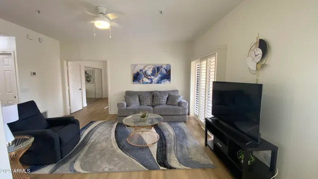 a living room with furniture and a flat screen tv