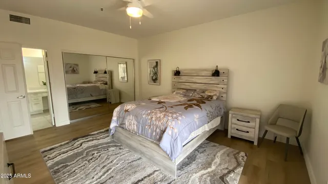 a bedroom with a bed and a view of bathroom