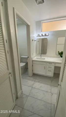 a bathroom with a bathtub and toilet