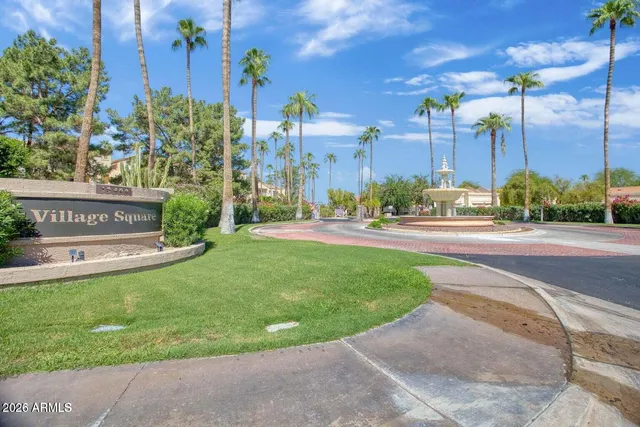 a view of a street with a building in the background