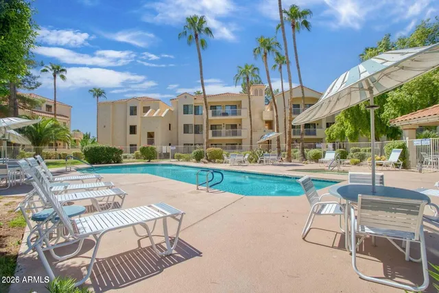 a view of parking garage with cars
