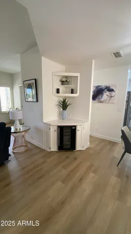a view of a living room and kitchen