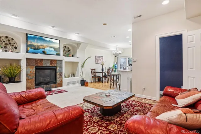 a living room with furniture and a fireplace