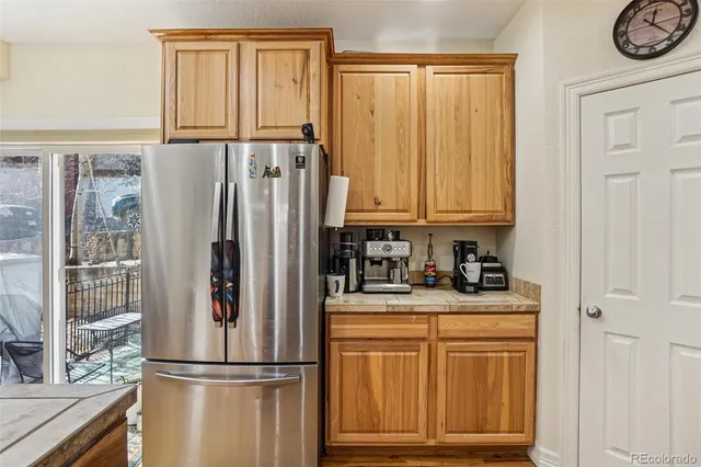 a kitchen with stainless steel appliances granite countertop a stove a microwave and cabinets