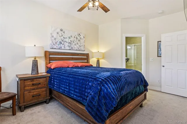 a bathroom with a granite countertop sink a mirror and a shower