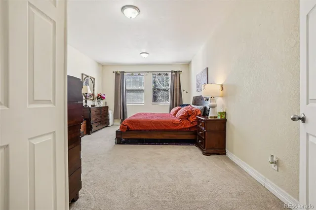 a bed room with a bed and furniture