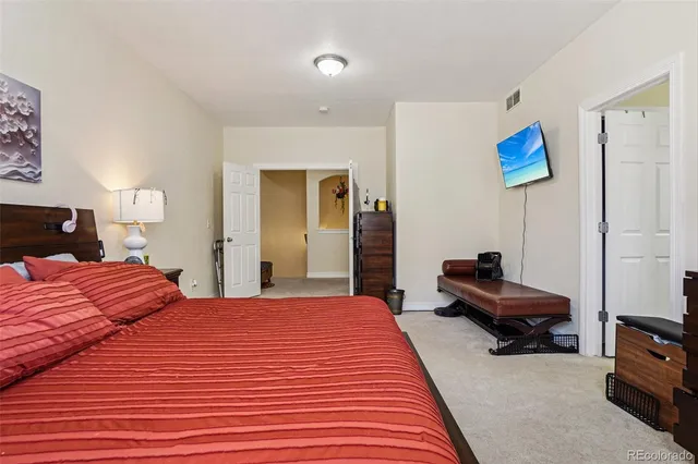 a bathroom with a double vanity sink mirror and toilet