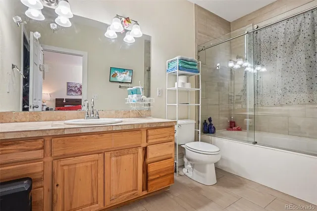 a bathroom with a shower and toilet