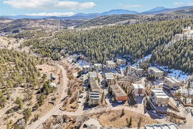 a aerial view of a house with a yard