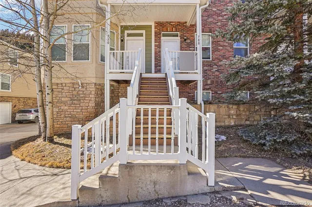 a front view of a house with stairs
