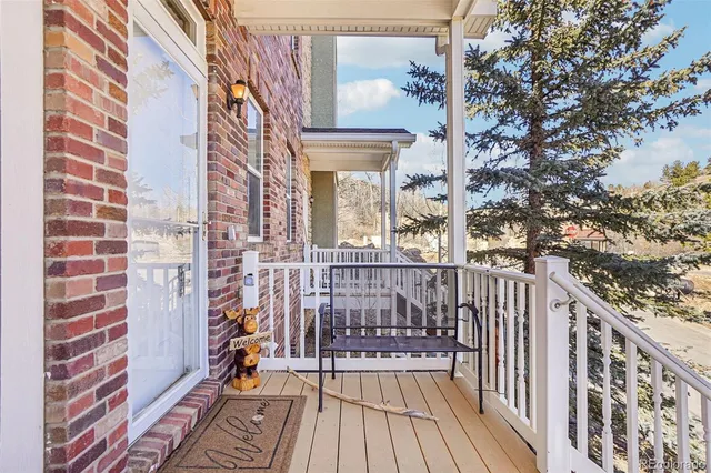 a view of a balcony with wooden floor