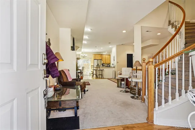 a view of a living room with furniture and a flat screen tv