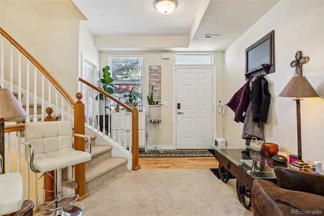 a living room with lots of furniture and a chandelier
