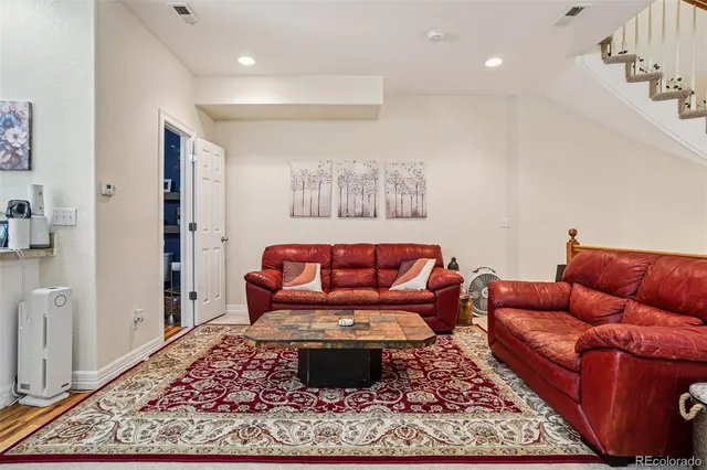 a living room with furniture and a couch