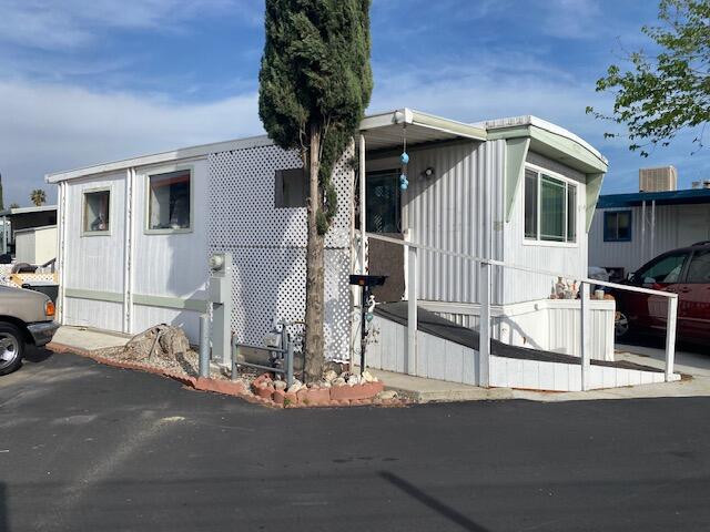 18323 Soledad Canyon Road Santa Clarita, CA 91387 - Photo 2 of 11 a view of a house with a street