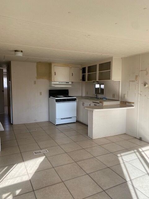 18323 Soledad Canyon Road Santa Clarita, CA 91387 - Photo 5 of 11 a kitchen with stainless steel appliances granite countertop a sink and cabinets
