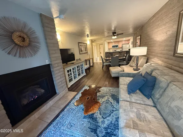 a living room with furniture and a fireplace