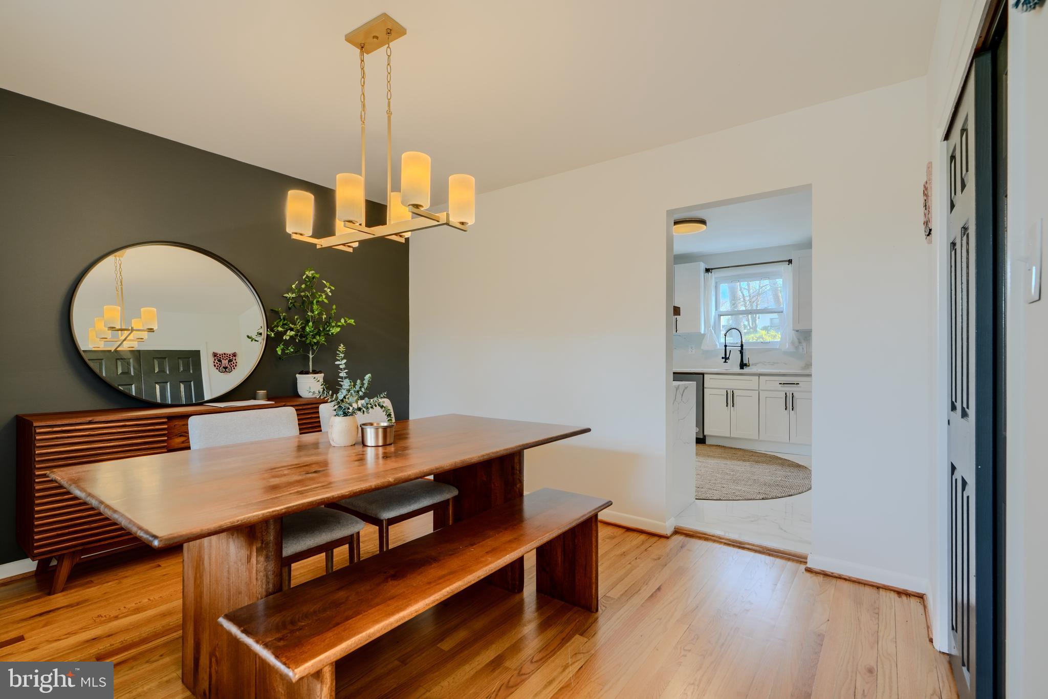 1103 Litchfield Road, Unit H Baltimore, MD 21239 - Photo 21 of 74 a view of a dining room with furniture and wooden floor
