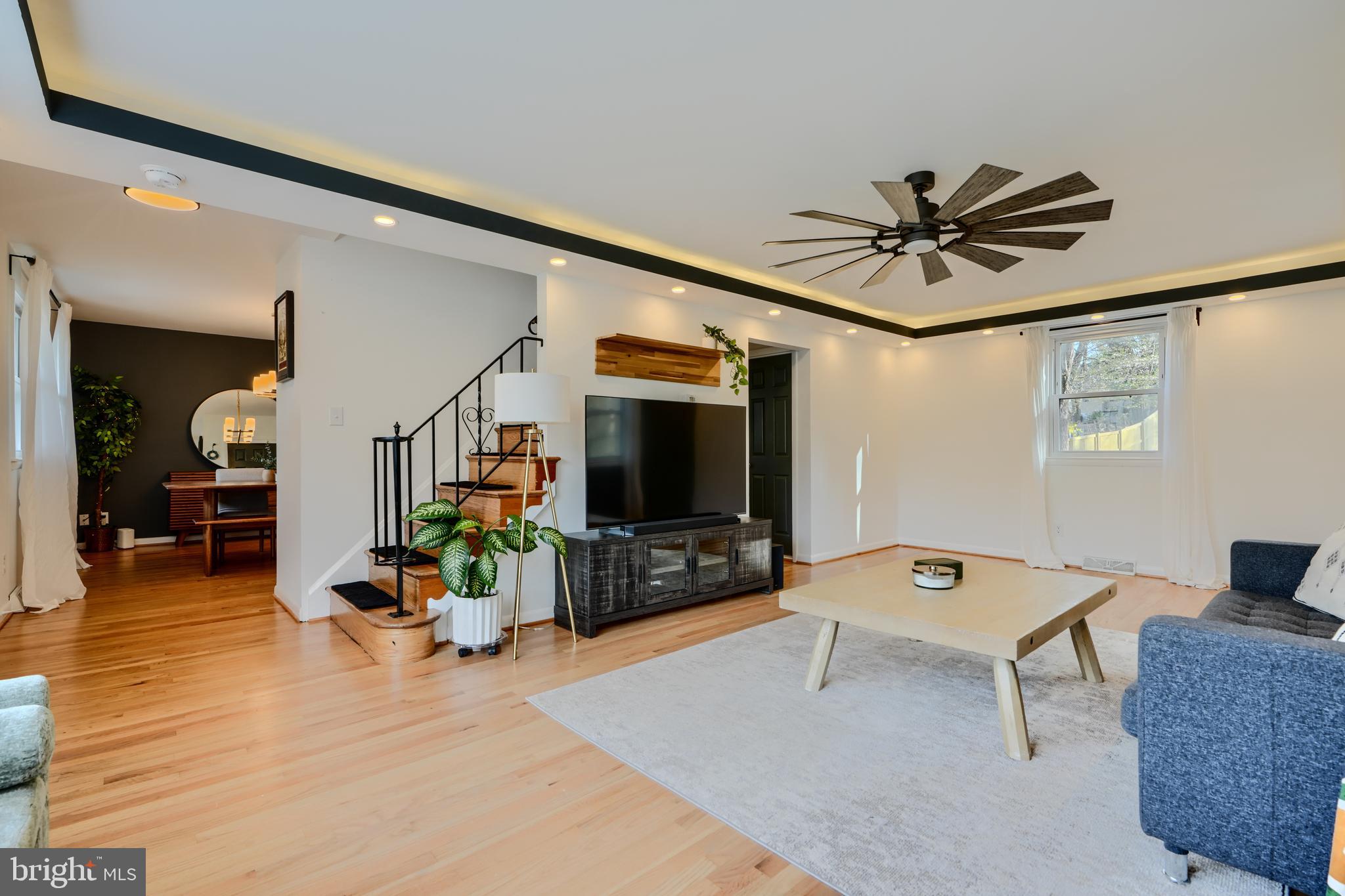 1103 Litchfield Road, Unit H Baltimore, MD 21239 - Photo 27 of 74 a living room with furniture and a flat screen tv