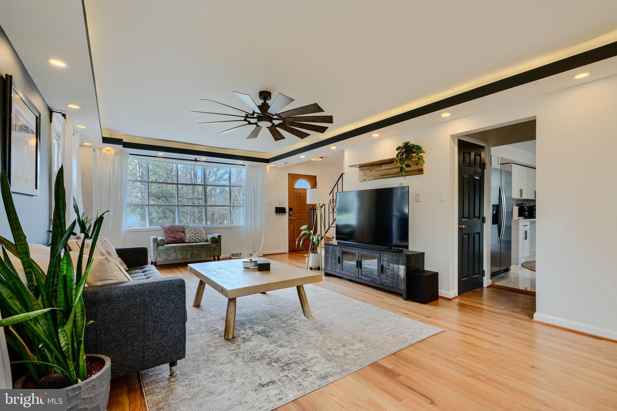 1103 Litchfield Road, Unit H Baltimore, MD 21239 - Photo 29 of 74 a living room with furniture and a flat screen tv