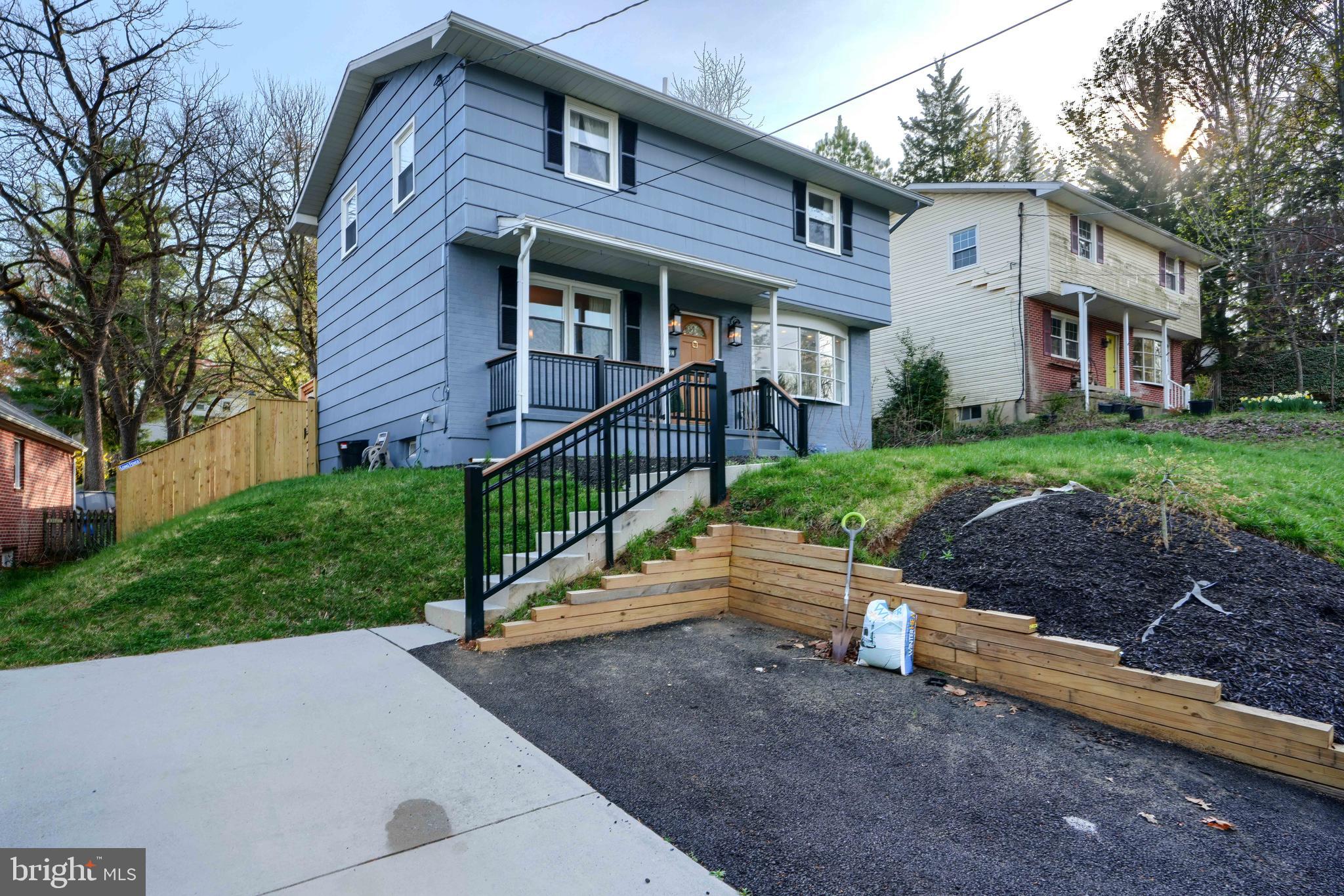 1103 Litchfield Road, Unit H Baltimore, MD 21239 - Photo 3 of 74 a front view of a house with a yard and fence