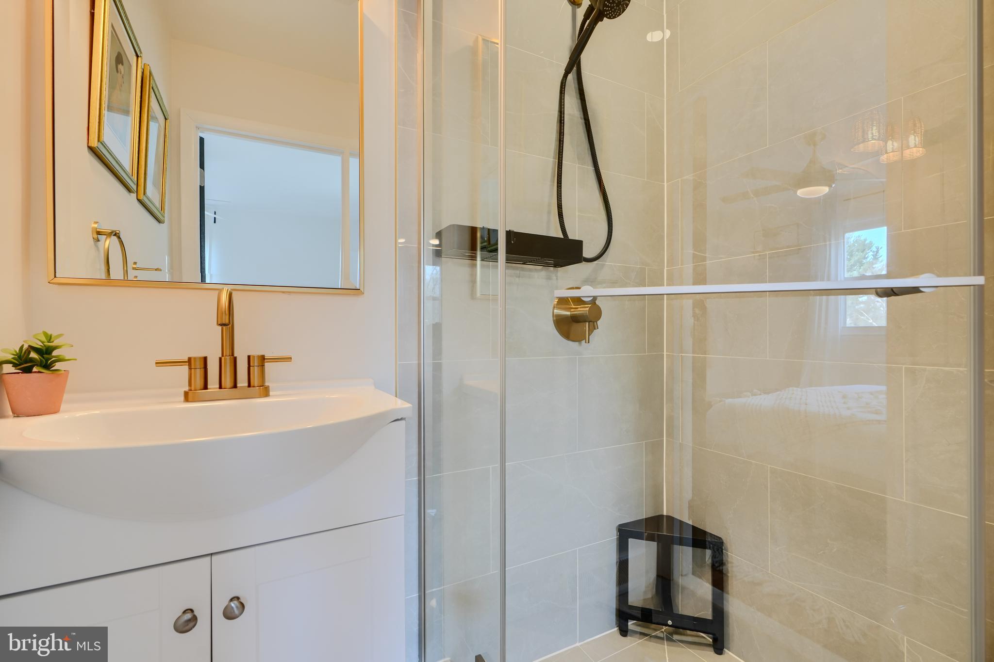 1103 Litchfield Road, Unit H Baltimore, MD 21239 - Photo 46 of 74 a bathroom with a sink and a shower