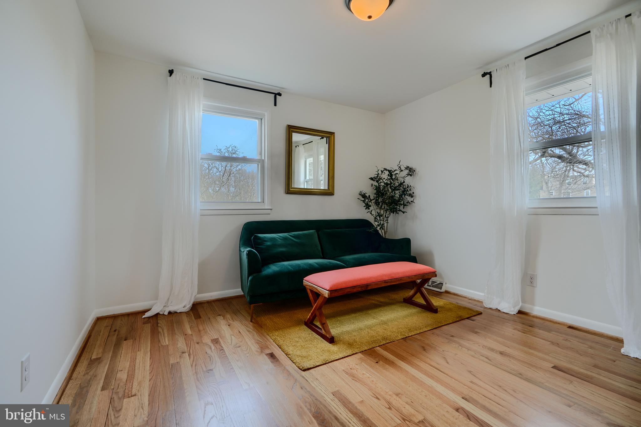 1103 Litchfield Road, Unit H Baltimore, MD 21239 - Photo 48 of 74 a room with furniture and wooden floor