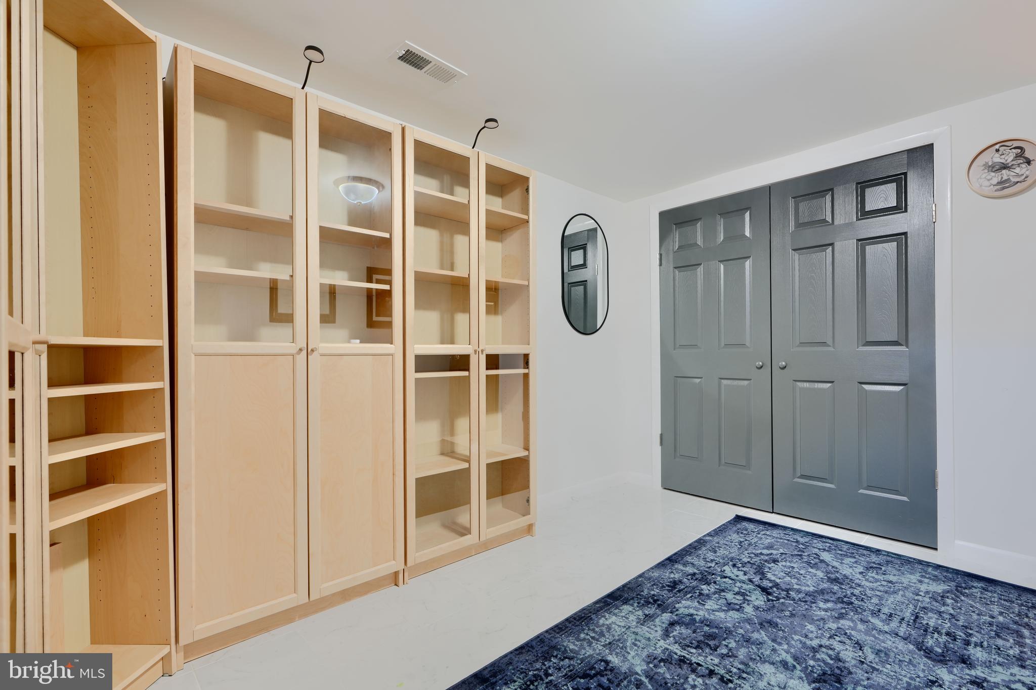 1103 Litchfield Road, Unit H Baltimore, MD 21239 - Photo 64 of 74 a view of an empty room with a door