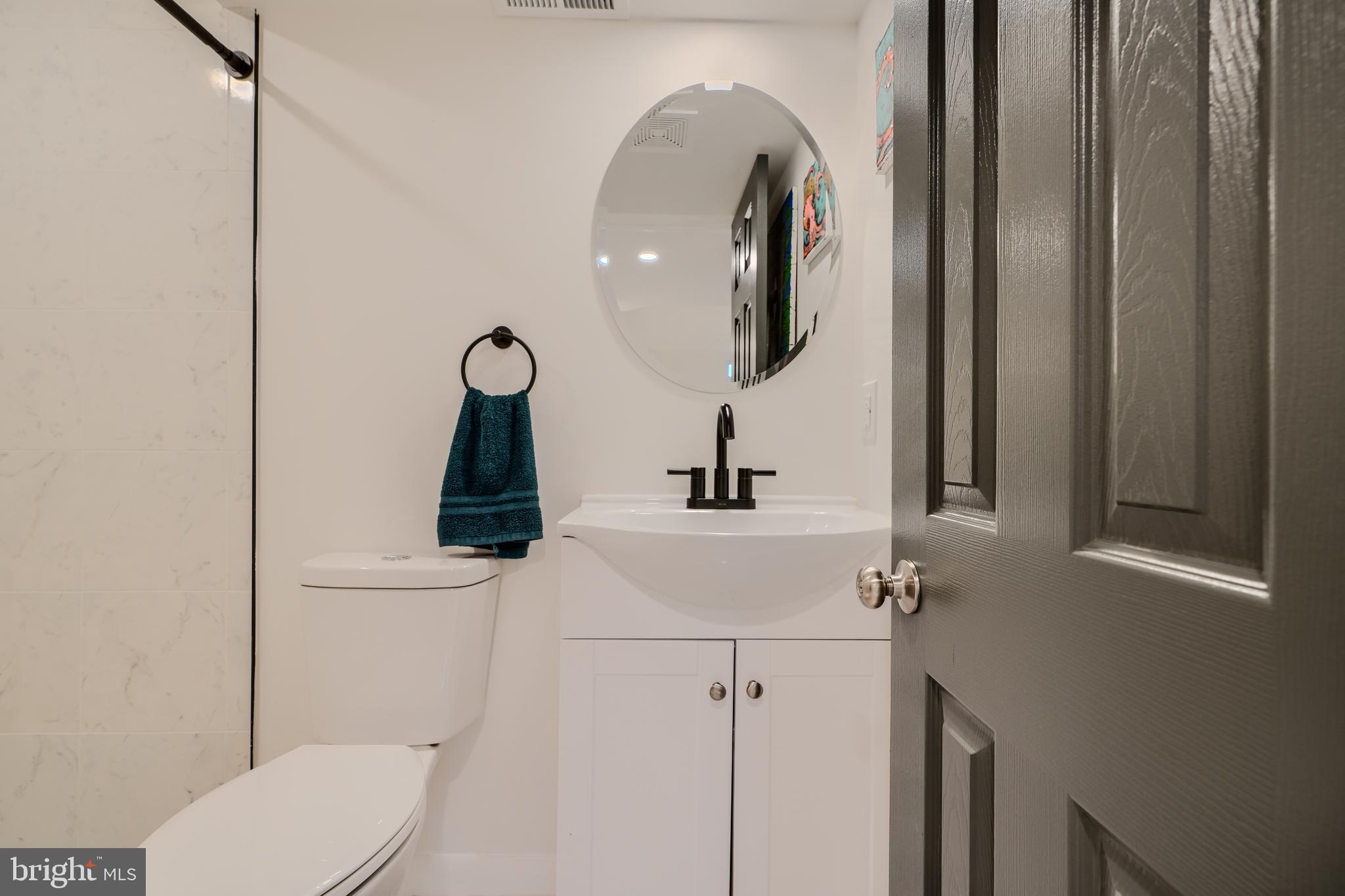 1103 Litchfield Road, Unit H Baltimore, MD 21239 - Photo 66 of 74 a bathroom with a toilet and a sink