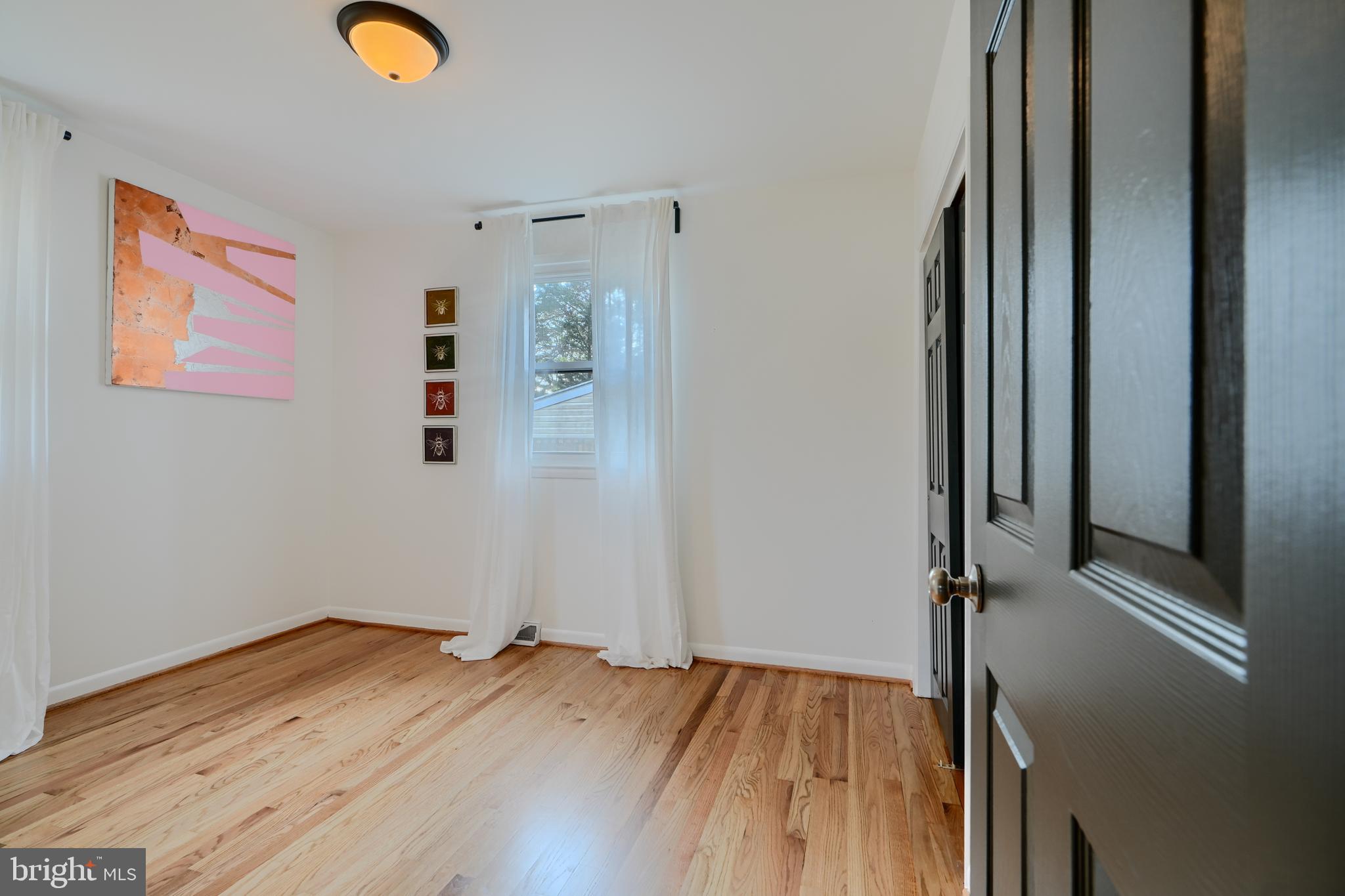 1103 Litchfield Road, Unit H Baltimore, MD 21239 - Photo 73 of 74 wooden floor in an empty room