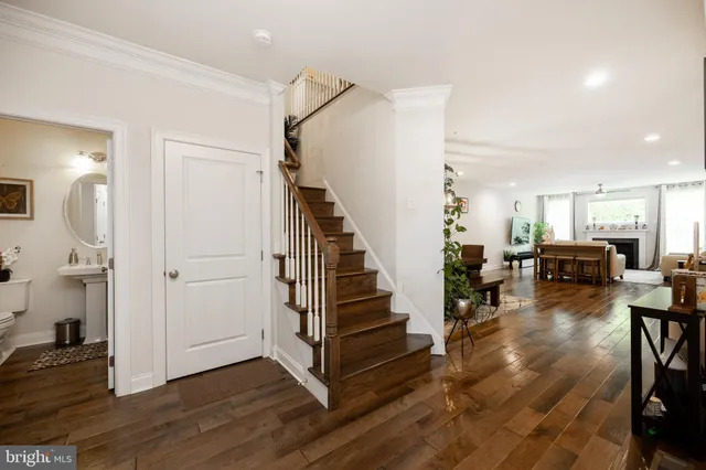 a view of a livingroom with furniture and stairs